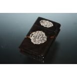 A CARVED ORIENTAL TYPE TORTOISESHELL CARD CASE OF SMALL PROPORTIONS, H 9.75 cm