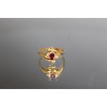 AN 18 CARAT YELLOW GOLD RUBY AND DIAMOND RING, the ruby being an estimated 0.30 carat, ring size O