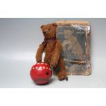 AN EARLY BING MECHANICAL MOHAIR BEAR 'BALL PLAYER', fully jointed, attached to a mechanical ball