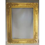A 19TH CENTURY GILT FRAME, with corner embellishments and integral slip, frame W 10 cm, rebate