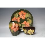 A LARGE MOORCROFT 'HIBISCUS' PATTERN PLATTER, Dia. 30.7 cm, together with a Moorcroft Hibiscus