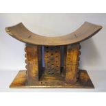 A 19TH CENTURY AFRICAN ASHANTI CARVED WOODEN STOOL, the base inscribed 'Ashantee chiefs stool,