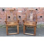 A PAIR OF EASTERN ELM ARMCHAIRS, with shaped and scrolled top rails above a pierced carved splat,