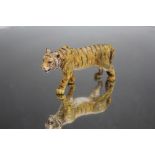 AN AUSTRIAN COLD PAINTED BRONZE FIGURE OF A WALKING TIGER, probably that of Franz Bergman,