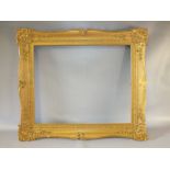 A 19TH CENTURY GILT SWEPT FRAME, with integral slip, frame W 11 cm, rebate size 66 x 54 cm