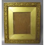 A NINETEENTH CENTURY HAND CARVED GOLD WOODEN FRAME, with gold slip and glazed, frame W 4 cm, slip