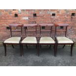 A SET OF FOUR EARLY 19TH CENTURY REGENCY MAHOGANY DINING CHAIRS, with a bar back over a drop in