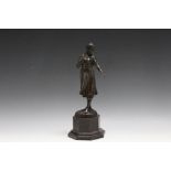 A FIGURE OF A LADY ON PLINTH, in a bronzed finish and on octagonal base, H 30 cm