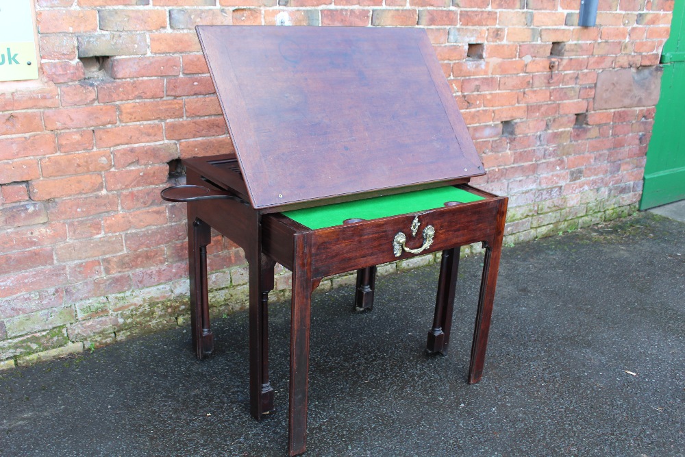 A GEORGIAN MAHOGANY CHIPPENDALE PERIOD ARCHITECTS TABLE, the hinged top with adjustable ratchet