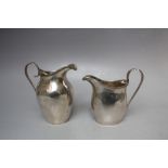 TWO GEORGIAN HALLMARKED SILVER CREAM JUGS, comprising Birmingham 1913 and Birmingham 1929, tallest H