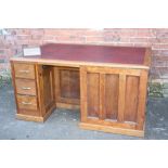 AN UNUSUAL OAK SHIPS CHART TABLE / DESK, having inset red leather writing surface, one end with a