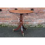 A GEORGE III MAHOGANY TILT TOP PEDESTAL TABLE, the one piece circular top with original snap lock