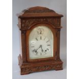 A WINTERHALDER & HOFMEIER MAHOGANY CASED MANTLE CLOCK, the silvered arch top dial with subsidiary