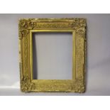 A NINETEENTH CENTURY GOLD SWEPT FRAME, frame W 6 cm, frame rebate 28 x 23 cm