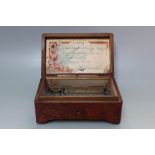 A BURR WALNUT CASED MINIATURE MUSIC BOX, the lid interior with label "4 AIRS, 1.