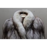 A LADIES VINTAGE BLUE FOX FUR JACKET BY FAULKES FURRIERS, fully lined, hook fasteners, supplied with