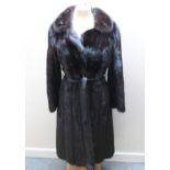 A LONG LENGTH 'BLACK EXCELLENT MINK' FUR COAT, described as labelled, makers label for Edelson, with