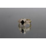 A HALLMARKED 9 CARAT YELLOW GOLD SAPPHIRE AND DIAMOND RING, ring size Q