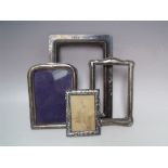 A COLLECTION OF HALLMARKED SILVER PICTURE FRAMES A/F, various styles and periods to include