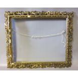 A 19TH CENTURY GOLD PLASTER FLORENTINE FRAME, frame W 8 cm, rebate 46 x 56 cm