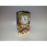 A MOORCROFT 'ANNA LILY' PATTERN CERAMIC CLOCK, tubeline decoration, impressed and painted marks to