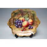 A ROYAL WORCESTER TWIN HANDLED DISH BY T. LOCKYER, decorated with fruit to a mossy background,