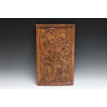 A CARVED PANEL, H 48.25 cm