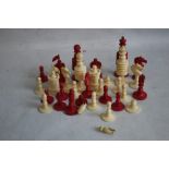 A BONE CHESS SET CONTAINED IN AN INDIAN CARVED WOOD BOX with only 31 pieces together with a set of