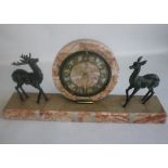 A FRENCH ART DECO MARBLE AND BRONZE MANTEL CLOCK. decorated with a doe and stag, L 45 cm