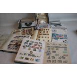 A QUANTITY OF STAMPS LOOSE AND IN ALBUMS