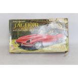 A BOXED MARX BATTERY OPERATED REMOTE CONTROL JAGUAR E-TYPE with head lights and horn A/F