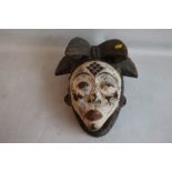 A PUNN-LUMBO TYPE TRIBAL MASK with painted white face