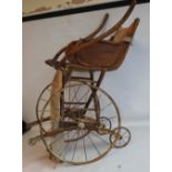 AN EDWARDIAN BENT WOOD BATH / INVALID CHAIR with metal wheels A/F