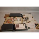 A STAMP ALBUM WITH CONTENTS, along with two albums of FDCs and covers etc.