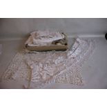 A BOX OF LINEN AND LACE to include table and tray cloths
