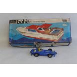 A BOXED PART MADE SELUCO 534 'BAHIA' MODEL MOTOR YACHT together with a battery operated Vanwall