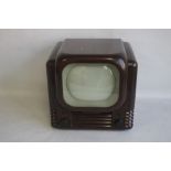 A BUSH TV22 VINTAGE BAKELITE TELEVISION, together with a period hoop aerial