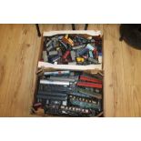 TWO TRAYS CONTAINING A LARGE COLLECTION OF '00' GAUGE CARRIAGES AND ROLLING STOCK, by Hornby,