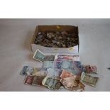 A BOX OF WORLD COINS AND NOTES