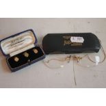 A BOXED SET OF THREE 9 CT GOLD COLLAR STUDS, along with a set of plated eye glasses