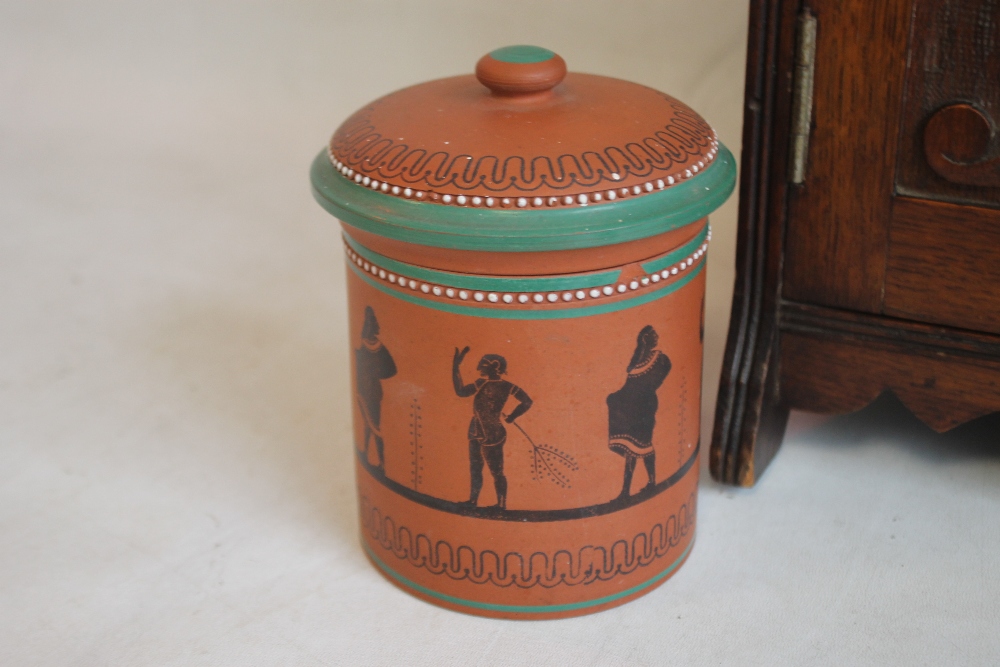 AN EDWARDIAN TWO DOOR SMOKERS' CABINET with terracotta tobacco jar, along with another jar and two - Image 5 of 5