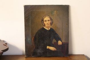 AN UNFRAMED OIL ON CANVAS PORTRAIT OF A SEATED LADY