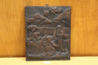 A CARVED WOODEN PANEL DEPICTING AN ARABLE SCENE