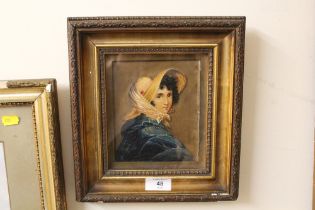 A FRAMED AND GLAZED OIL ON CARD PORTRAIT OF A YOUNG WOMAN IN A BONNET