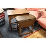 AN OAK CARVED OCCASIONAL TABLE AND A SMALL OAK DROPLEAF TABLE (2)