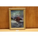 A GILT FRAMED OIL ON PANEL OF A FISHING BOAT AT SEA,