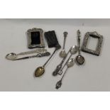 TWO MINIATURE SILVER PICTURE FRAMES, SPOONS ETC