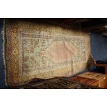 A LATE 19TH / EARLY 20TH CENTURY WOOLLEN PERSIAN RUG, decorated with floral detail, L 210 cm, W
