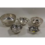 A COLLECTION OF WHITE METAL BOWLS