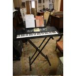 A YAMAHA YPT . 200 ELECTRIC KEYBOARD AND STAND H/C